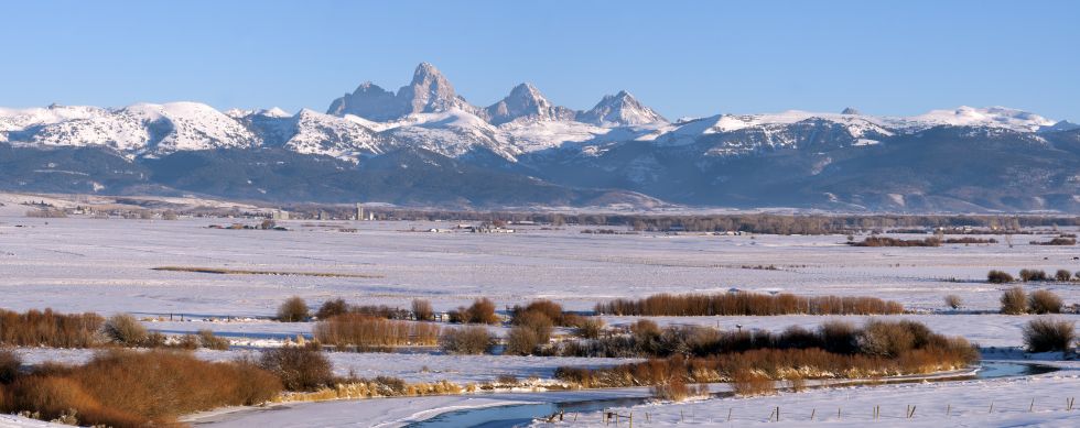 The Teton Valley lays gently before the Grand Tetons
