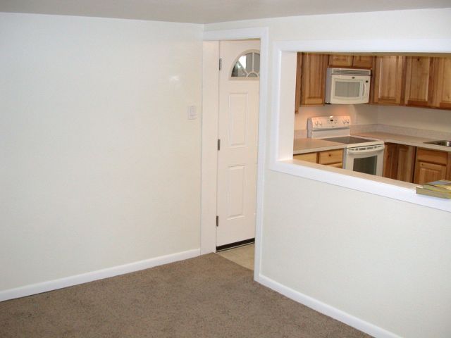 Living room with opening to kitchen