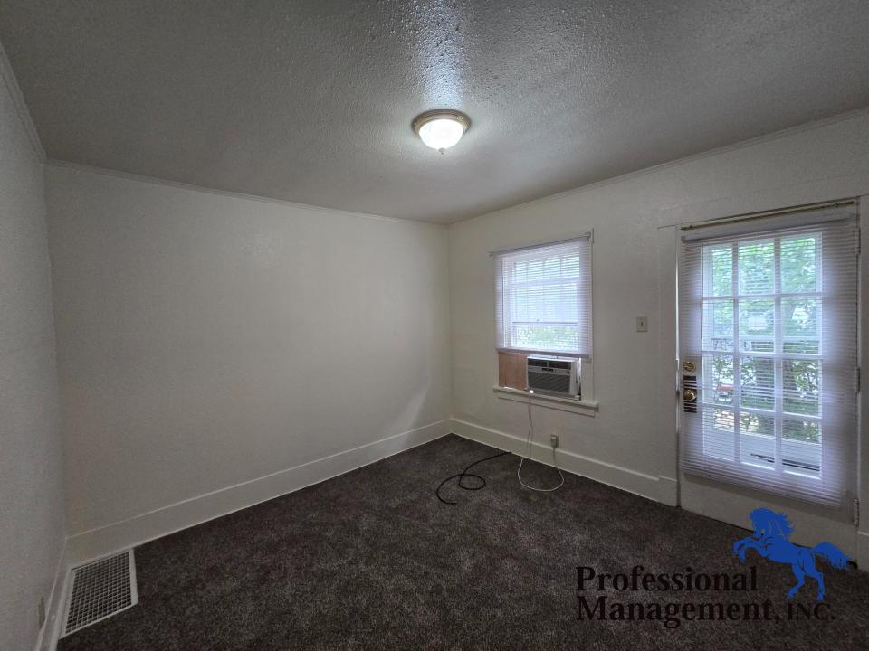 Living Room with Window A/C Unit