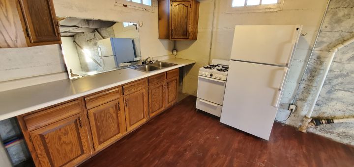 Kitchen w/ Large Fridge & Gas Stove