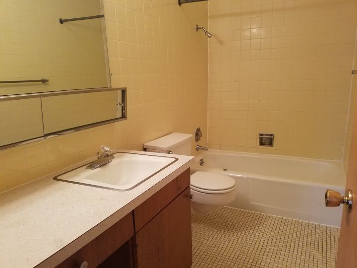 Full Bathroom with Counter Space and Real Tiling