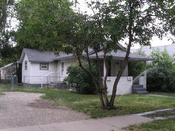 House with trees & shrubs